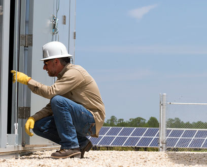Employee at the Babcok Ranch Solar and Energy Storage Center. Employee at the Babcok Ranch Solar and Energy Storage Center.